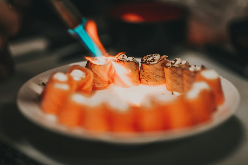 Gourmet sushi being torched with butane torch Gas Canister Applications